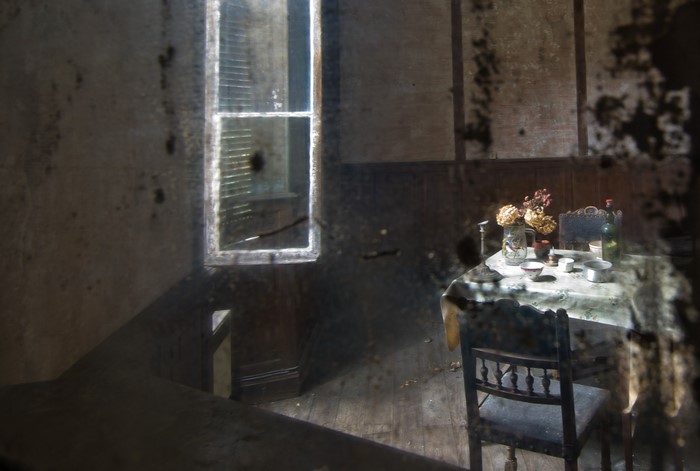 Abandoned room with table and window