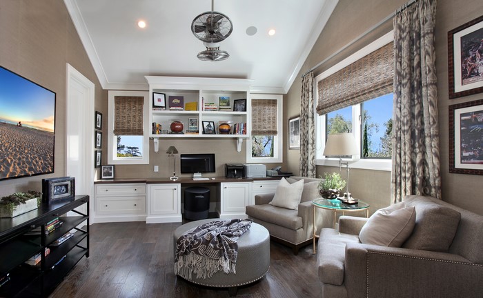 Home office with built-in shelves and seating