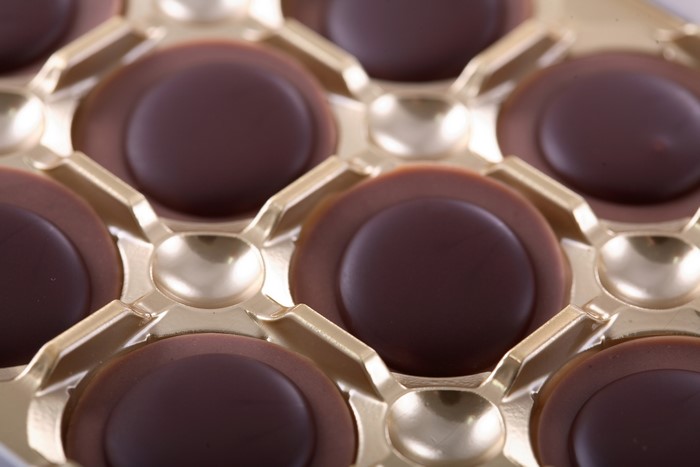 Chocolate candies in a golden tray