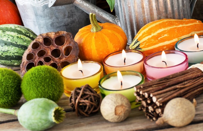 Autumn still life with pumpkins and candles