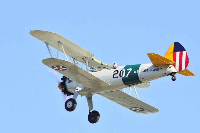 Vintage U.S. Coast Guard Biplane in Flight