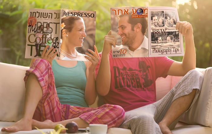 Couple holding magazines with Nespresso and photography tips