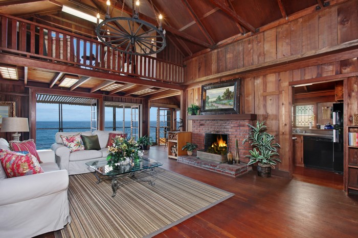 Living room with fireplace and ocean view