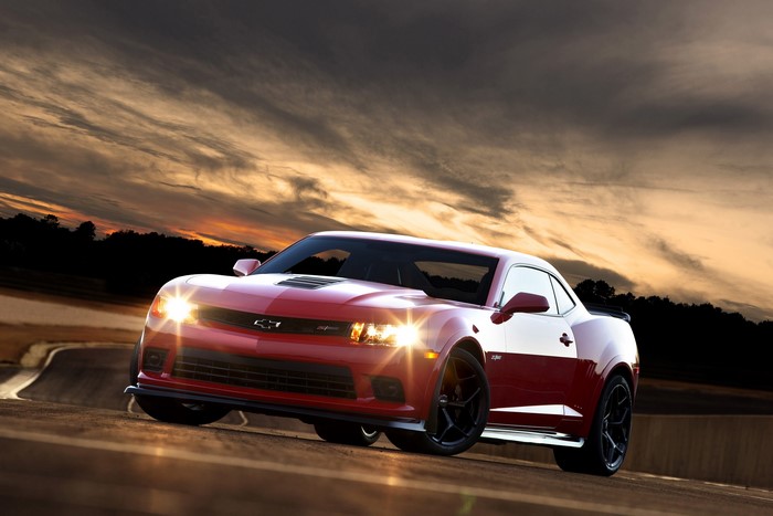 Red 2015 Chevrolet Camaro Z28 on a track