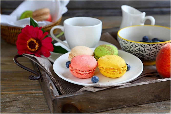 Macarons, Coffee Cup, Flower, and Fruit on a Tray