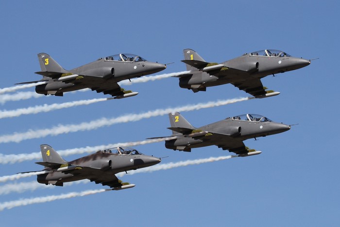 Four Hawker Hunter fighter jets flying in formation
