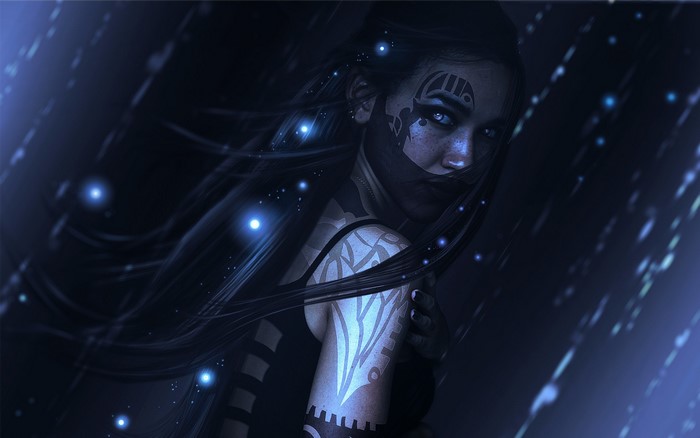 Woman with tattoos and glowing particles