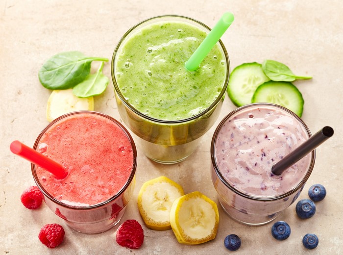 Three smoothies with fruits and vegetables