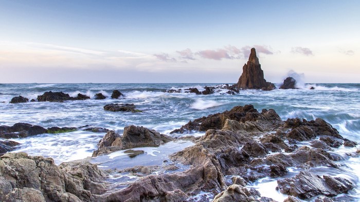 Rocky coastline with waves crashing in Spain