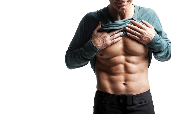 Man showing defined abdominal muscles