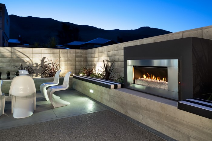 Modern outdoor patio with fireplace and seating