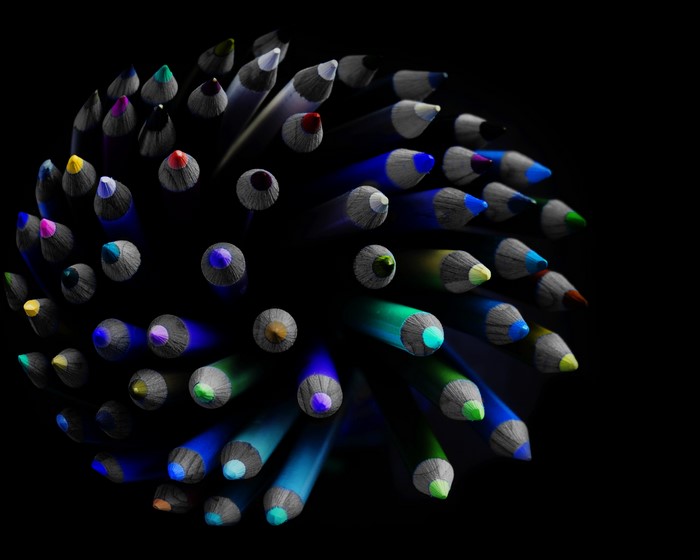 Close-up of colorful pencils on a black background