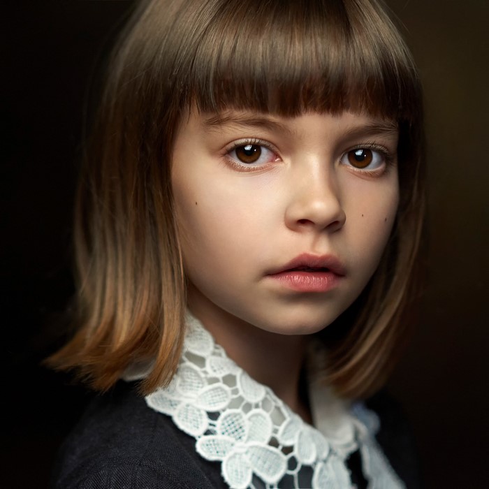 Portrait of a Little Girl with Thoughtful Glance