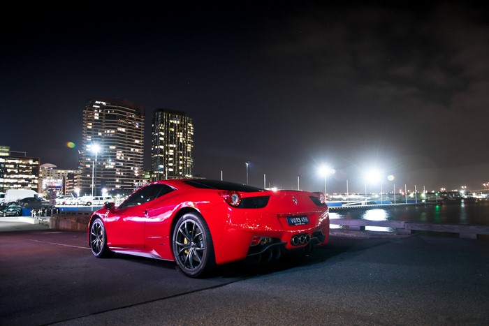 Red Ferrari 458 at Night with City Skyline