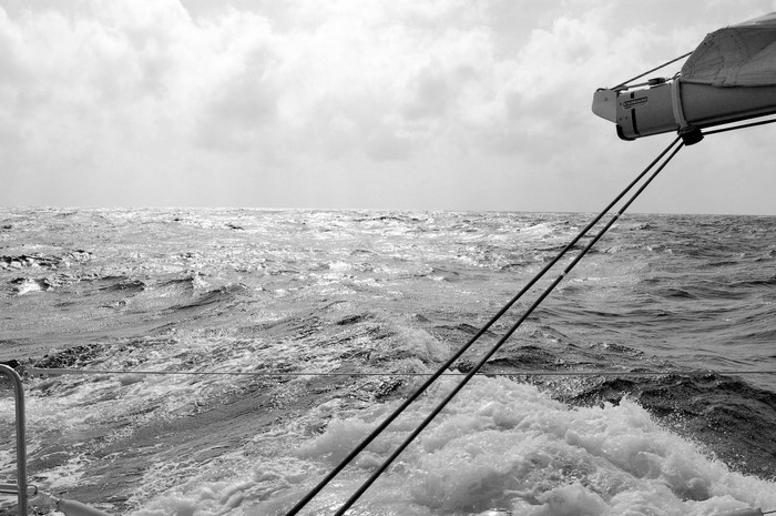 Sailing on a choppy sea under a cloudy sky