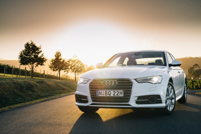 White Audi A6 Sedan on a Road at Sunset