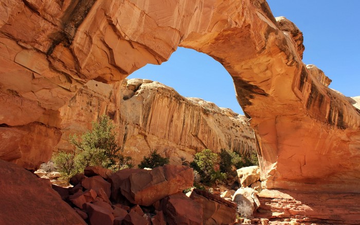 Natural sandstone arch in a desert canyon