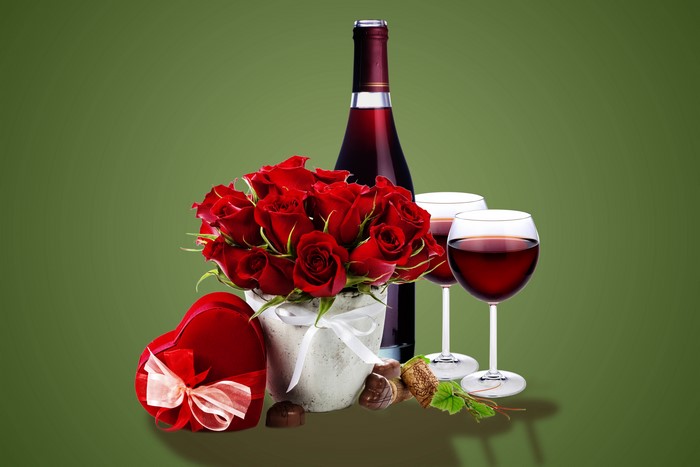 Wine bottle, roses, wine glasses, and heart-shaped gift
