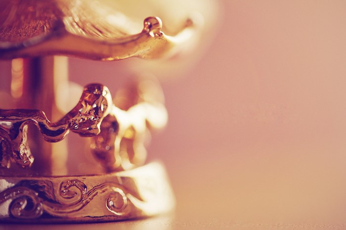 Close-up of a golden carousel souvenir