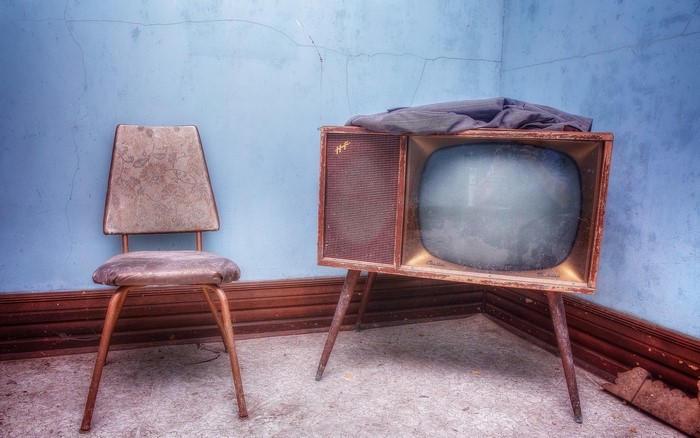 Old chair and vintage television set