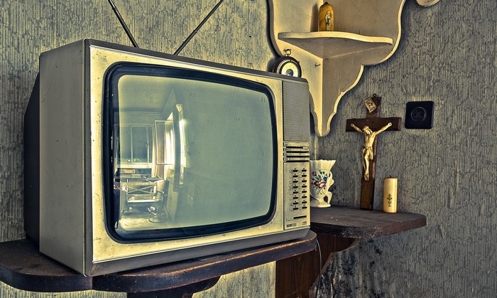 Old retro TV set on a shelf