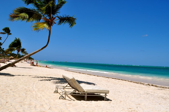 4K Punta Cana Beach with Palm Trees and Sunlounger