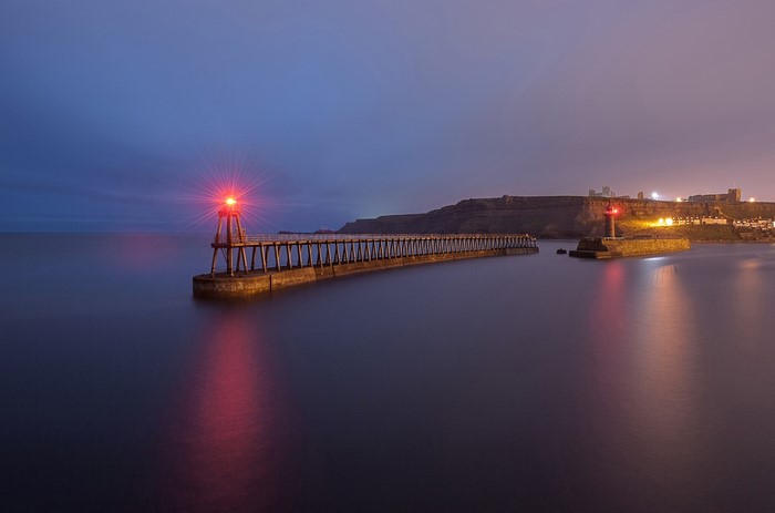 Lighthouses on a pier at dusk