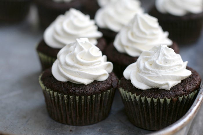 Chocolate cupcakes with white frosting