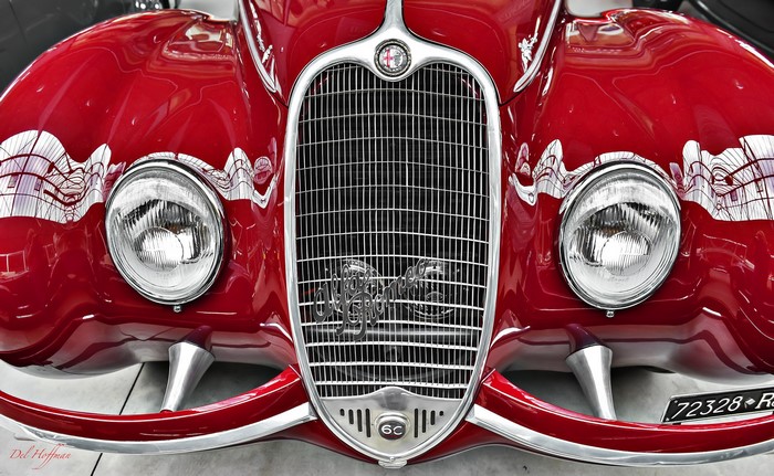 Red Alfa Romeo car front grille and headlights
