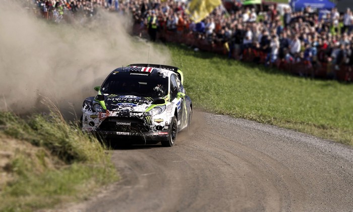 Ford Fiesta WRC car kicking up dust on a rally track