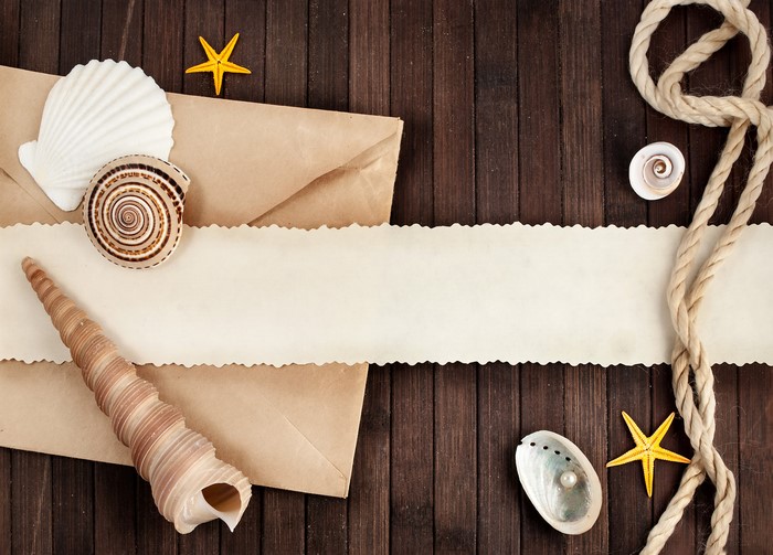 Shells, Starfish, and Rope on Wooden Background