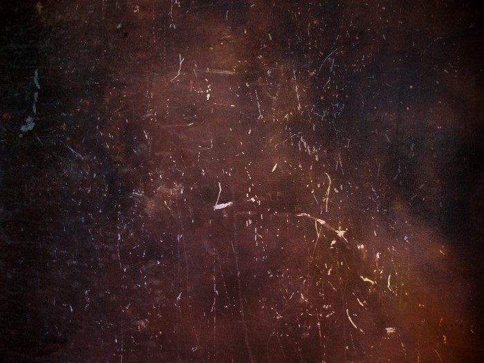 Dark textured surface with scratches