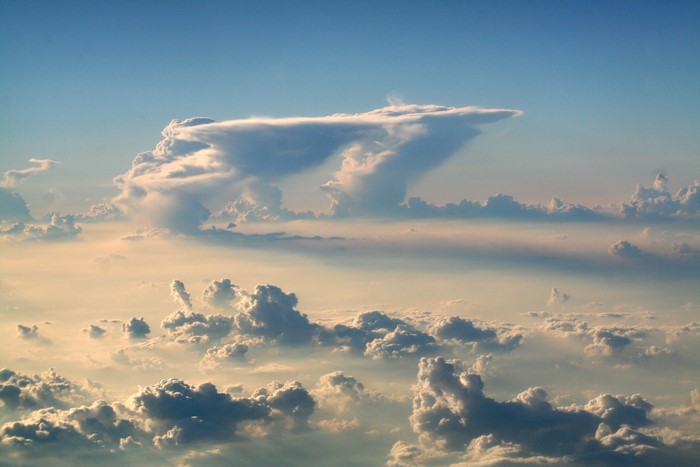 Clouds in the sky from an airplane window