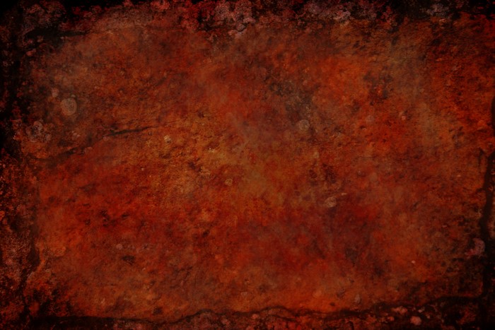 Rusty and textured surface with dark edges