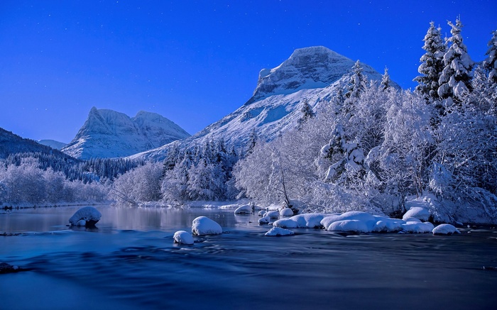 Snowy Mountains and River Under a Starry Blue Sky