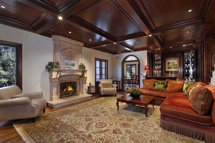 Living room with fireplace, carpet, and sofa