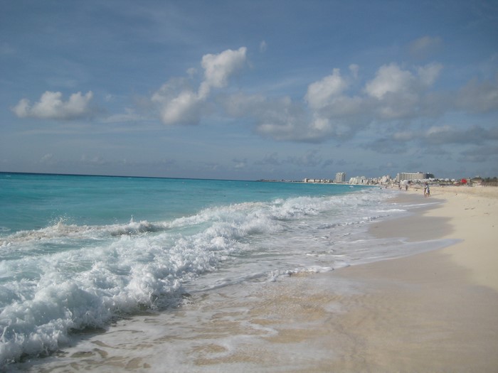 Cancun beach with turquoise water and buildings