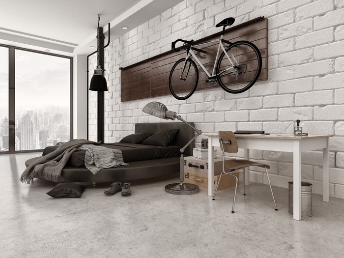 Modern bedroom with bicycle and desk