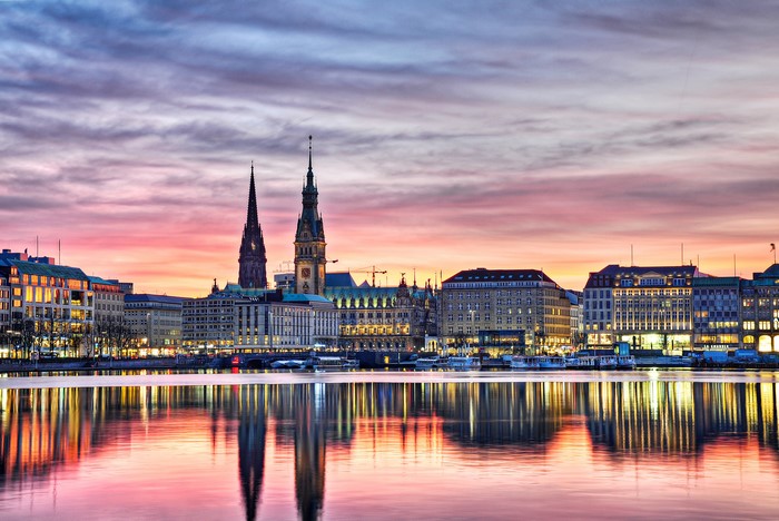 Hamburg skyline at sunset with river reflections