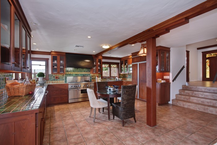 Kitchen with wooden cabinets and island