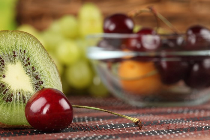 Kiwi, Cherry, and Grapes on a Table