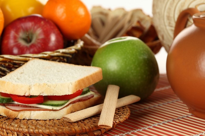 Sandwich with fruits and a jug