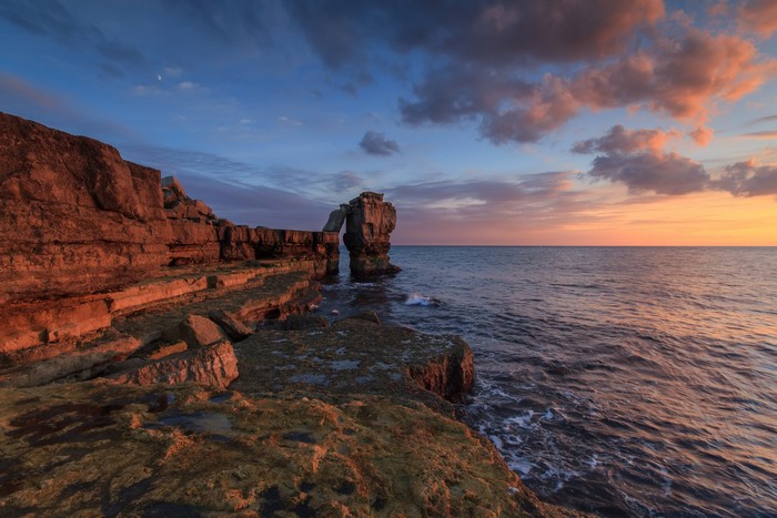 Portland Bill rock arch at sunset, Dorset, UK