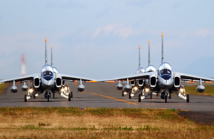 Fighter jets taxiing on a runway