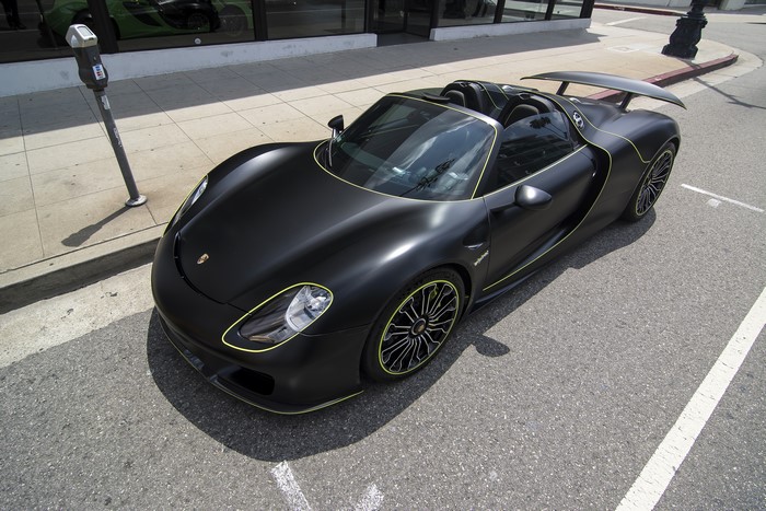 Black Porsche 918 Spyder parked on street