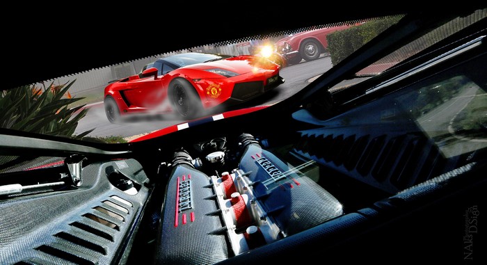 Red Ferrari sports car on a race track