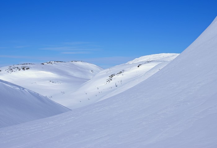 Snowy mountains under a clear blue sky