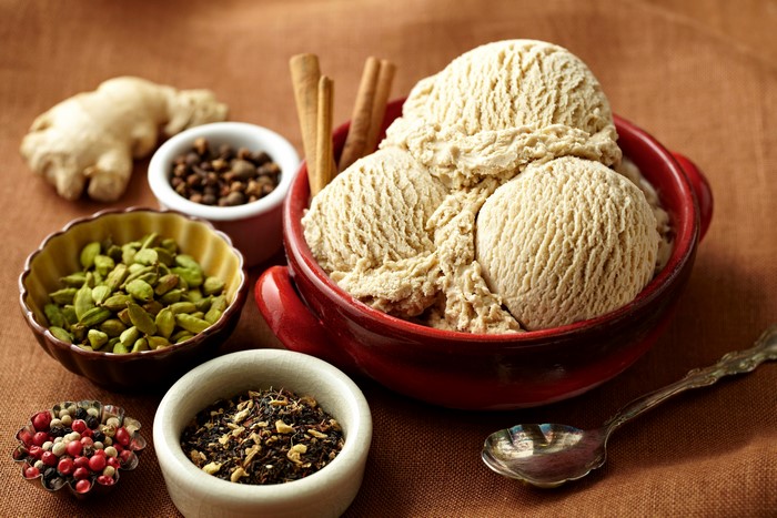 Ice cream with spices and spoon