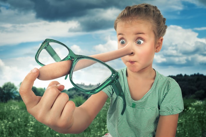 Girl with Pinocchio nose and glasses