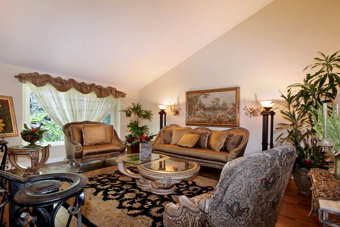 Living room with sofa, armchair, and carpet
